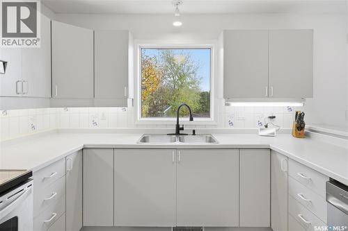 614 Reid Road, Saskatoon, SK - Indoor Photo Showing Kitchen With Double Sink