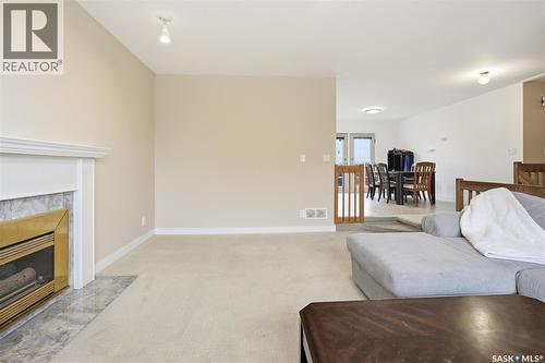 614 Reid Road, Saskatoon, SK - Indoor Photo Showing Living Room With Fireplace