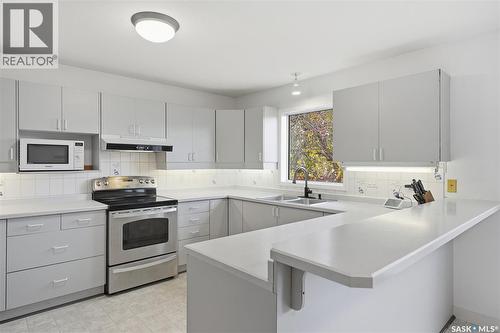 614 Reid Road, Saskatoon, SK - Indoor Photo Showing Kitchen With Double Sink