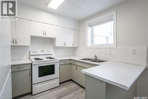 1409 Preston Avenue S, Saskatoon, SK - Indoor Photo Showing Kitchen With Double Sink