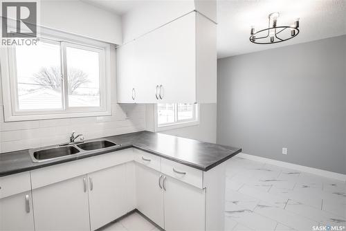 1409 Preston Avenue S, Saskatoon, SK - Indoor Photo Showing Kitchen With Double Sink