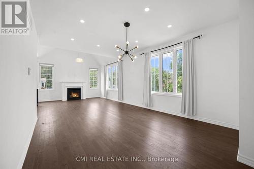 3205 Mosley Street, Wasaga Beach, ON - Indoor Photo Showing Living Room With Fireplace