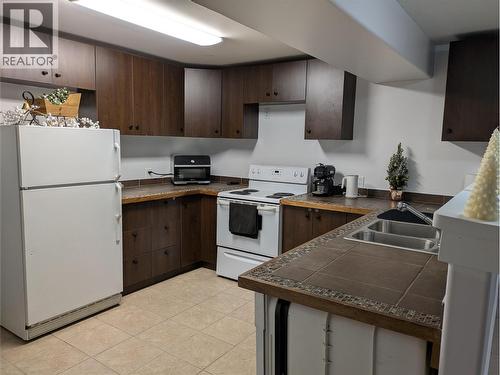 Lower Level - 3576 Rose Road, Kelowna, BC - Indoor Photo Showing Kitchen With Double Sink