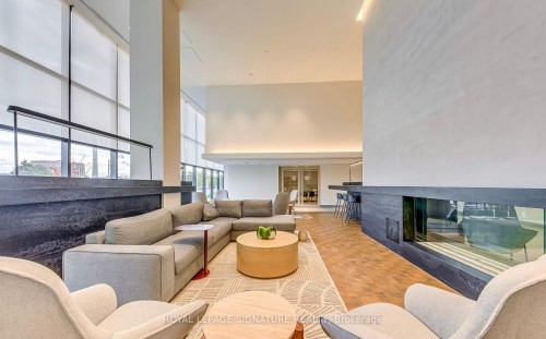 920-1050 Eastern Avenue, Toronto, ON - Indoor Photo Showing Living Room With Fireplace