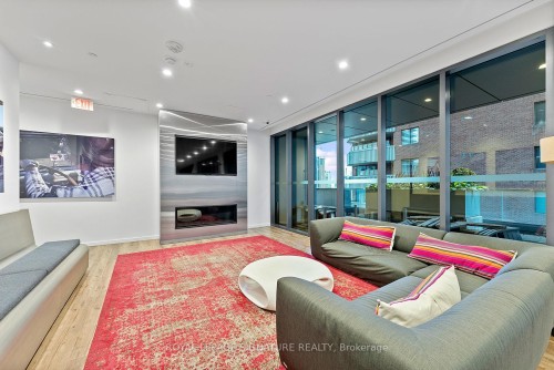 411-159 Dundas Street E, Toronto, ON - Indoor Photo Showing Living Room With Fireplace