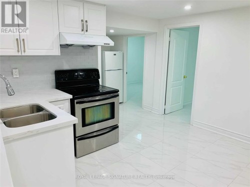 Lower-23 Lynmont Road, Toronto, ON - Indoor Photo Showing Kitchen With Double Sink