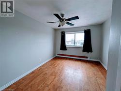 Main bedroom with cork floors, and ceiling fan - 