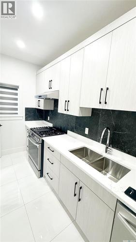430 Nazarali Manor, Saskatoon, SK - Indoor Photo Showing Kitchen With Double Sink