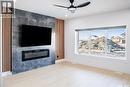 430 Nazarali Manor, Saskatoon, SK  - Indoor Photo Showing Living Room With Fireplace 