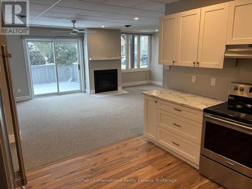 Kitchen/Living Room - 62 - 209472 26 Highway, Blue Mountains, ON - Indoor Photo Showing Kitchen With Fireplace