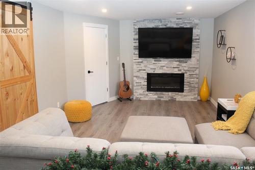 3330 Green Moss Lane, Regina, SK - Indoor Photo Showing Living Room With Fireplace