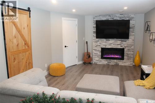 3330 Green Moss Lane, Regina, SK - Indoor Photo Showing Living Room With Fireplace