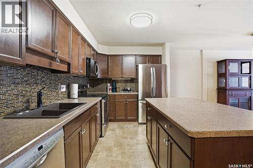 103 2351 Windsor Park Road, Regina, SK - Indoor Photo Showing Kitchen With Stainless Steel Kitchen With Double Sink