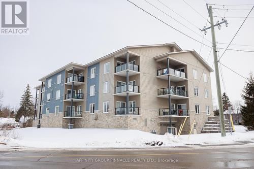 103 - 94 Francis Street W, Kawartha Lakes (Fenelon Falls), ON - Outdoor With Balcony With Facade