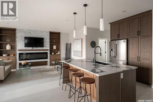 3748 Gee Crescent, Regina, SK - Indoor Photo Showing Kitchen With Fireplace With Upgraded Kitchen