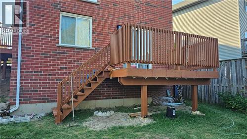 Wooden deck with stairs and a lawn - 10 Doll Court Unit# Lower, Kitchener, ON - Outdoor With Exterior