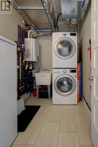 403 - 130 Water Street, Gananoque, ON - Indoor Photo Showing Laundry Room