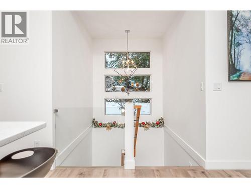 Stairway to lower level - 9196 Tronson Road Unit# 29, Vernon, BC - Indoor Photo Showing Other Room