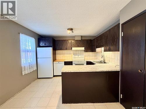20 4Th Avenue E, Neilburg, SK - Indoor Photo Showing Kitchen With Double Sink