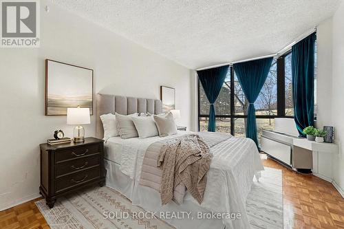 floor to ceiling windows - 108 - 2871 Richmond Road, Ottawa, ON - Indoor Photo Showing Bedroom