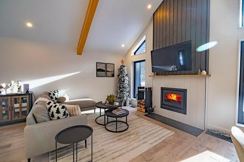 Aerial photo - 215 Ch. Des Chênes, Amherst, QC - Indoor Photo Showing Other Room With Fireplace