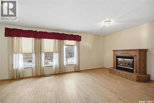 330 Fehr Crescent, Martensville, SK - Indoor Photo Showing Living Room With Fireplace