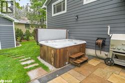 View of patio / terrace with a hot tub and grilling area - 