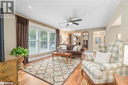 Living area with light wood-style floors, ceiling fan, and recessed lighting - 13609 Sixth Line, Limehouse, ON - Indoor Photo Showing Living Room