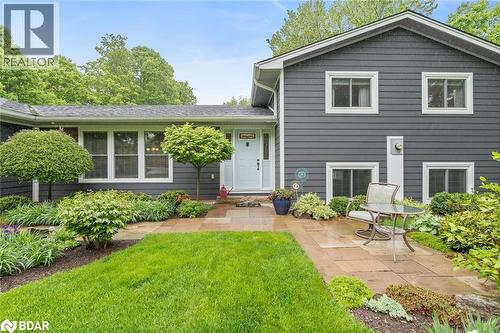 View of front of property with a front lawn and roof with shingles - 13609 Sixth Line, Limehouse, ON - Outdoor