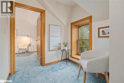 Sitting room with carpet flooring and vaulted ceiling - 