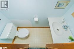 Bathroom featuring toilet and vanity - 