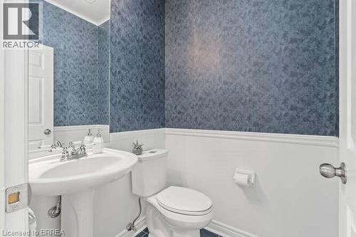 Bathroom featuring wainscoting and wallpapered walls - 119 Parkview Lane, Rockwood, ON - Indoor Photo Showing Bathroom