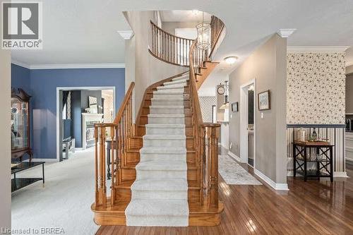 Stairs with crown molding and hardwood / wood-style floors - 119 Parkview Lane, Rockwood, ON - Indoor Photo Showing Other Room