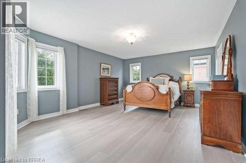 Bedroom featuring multiple windows and light wood-type flooring - 119 Parkview Lane, Rockwood, ON - Indoor Photo Showing Bedroom