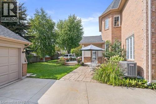 View of grassy yard with a patio area - 119 Parkview Lane, Rockwood, ON - Outdoor