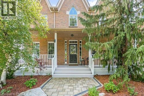Property entrance featuring a porch and brick siding - 119 Parkview Lane, Rockwood, ON - Outdoor With Deck Patio Veranda