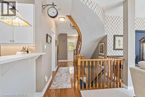 Hallway with an upstairs landing, light wood-type flooring, and vaulted ceiling - 119 Parkview Lane, Rockwood, ON - Indoor Photo Showing Other Room