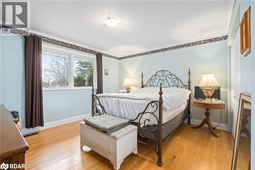 Bedroom featuring light wood-type flooring and baseboards - 11317 Regional Road 25, Halton Hills, ON - Indoor Photo Showing Bedroom