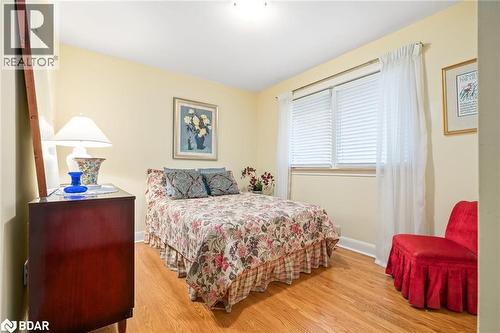 Bedroom featuring light wood-style flooring and baseboards - 11317 Regional Road 25, Halton Hills, ON - Indoor Photo Showing Bedroom