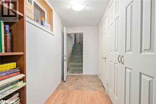 Corridor featuring stairs and light wood finished floors - 11317 Regional Road 25, Halton Hills, ON - Indoor Photo Showing Other Room