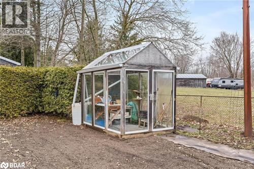 View of greenhouse featuring a fenced backyard and a sunroom - 11317 Regional Road 25, Halton Hills, ON - Outdoor