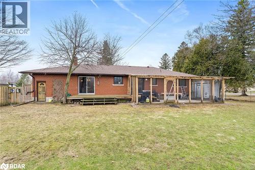 Back of house featuring brick siding and a wooden deck - 11317 Regional Road 25, Halton Hills, ON - Outdoor