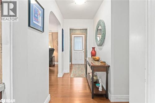 Hallway featuring arched walkways and light wood-style flooring - 11317 Regional Road 25, Halton Hills, ON - Indoor Photo Showing Other Room