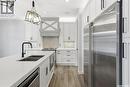 559 Bolstad Turn, Saskatoon, SK  - Indoor Photo Showing Kitchen With Double Sink With Upgraded Kitchen 