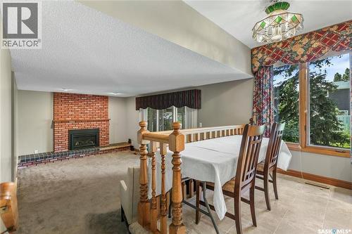 10 Selkirk Crescent, Regina, SK - Indoor Photo Showing Dining Room With Fireplace