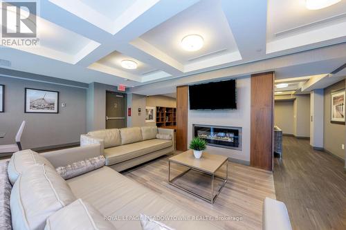 505 - 150 Main Street W, Hamilton, ON - Indoor With Fireplace