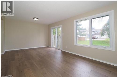 Empty room featuring wood-type flooring - 455 Kingscourt Drive Unit# 3, Waterloo, ON - Indoor Photo Showing Other Room