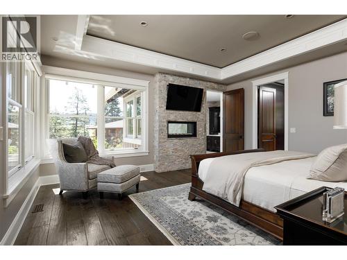 622 Jigger Place, Vernon, BC - Indoor Photo Showing Bedroom With Fireplace