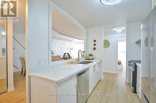 713 - 35 Trailwood Drive, Mississauga, ON - Indoor Photo Showing Kitchen With Double Sink