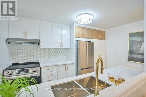 713 - 35 Trailwood Drive, Mississauga, ON - Indoor Photo Showing Kitchen With Double Sink